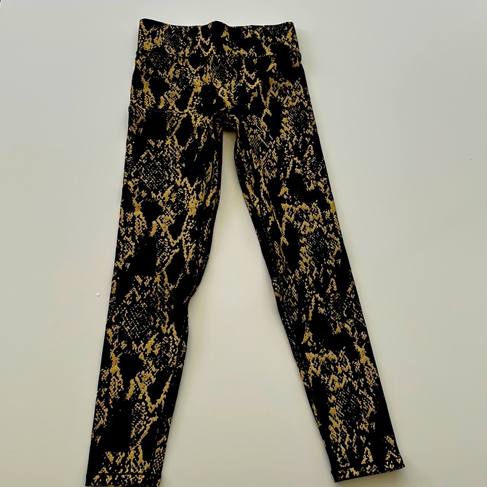 NOLI snakeskin tights. reflective for color changing and safety.